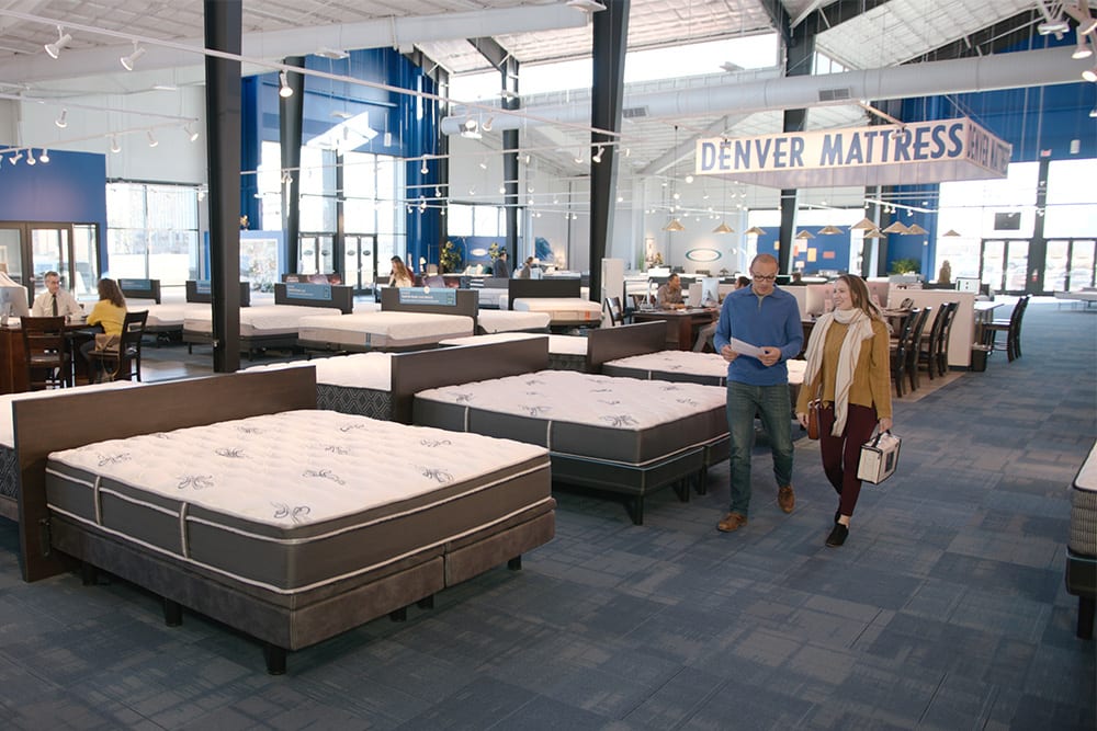 Denver Mattress Showroom floor with customers shopping for mattresses and sheets